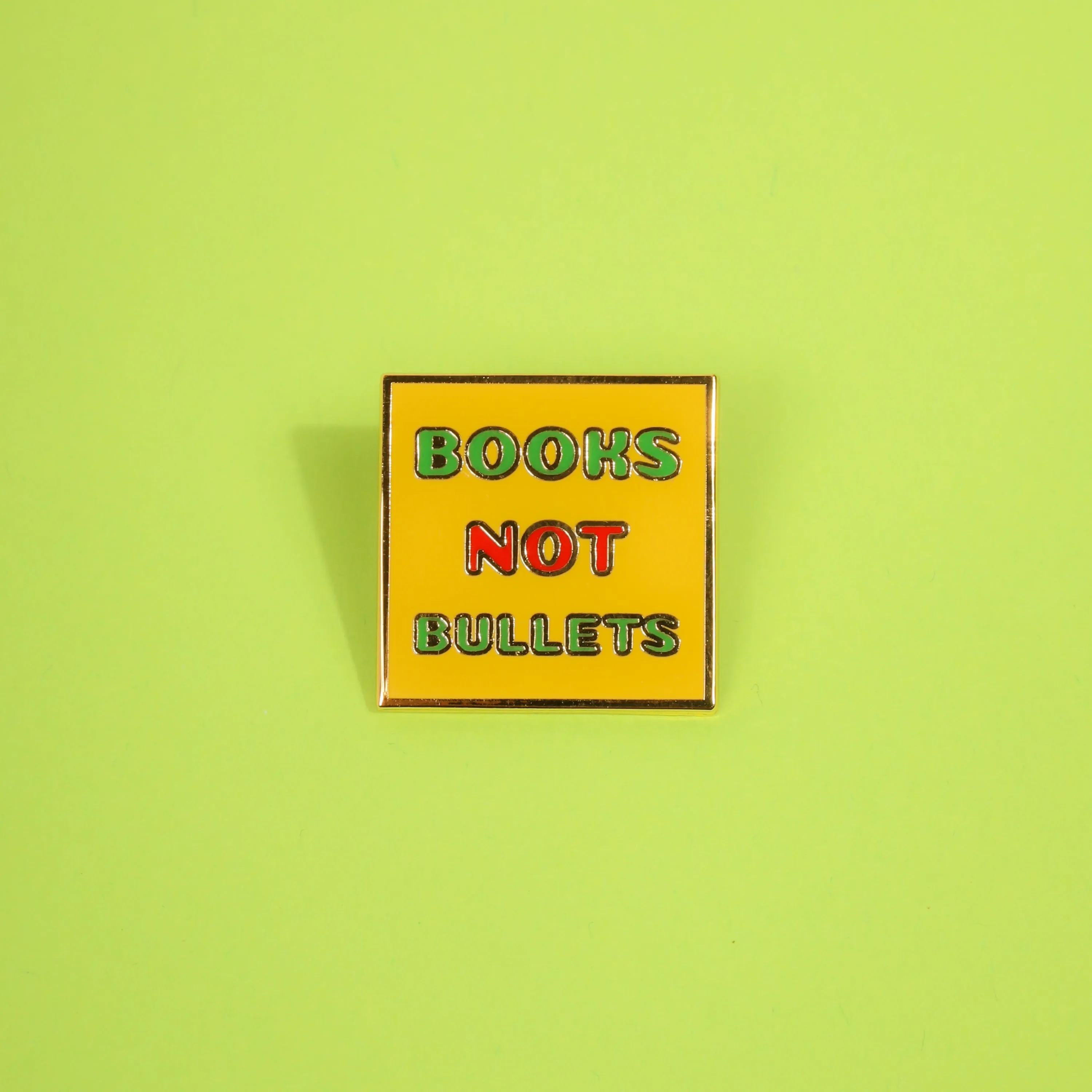 Books Not Bullets Enamel Pin